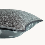 Side shot of an achromatic piped cushion cushion