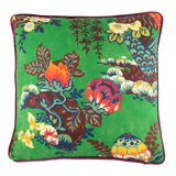 Cushion with a bright emerald background and large scale bunch of interesting flowers and branches in yellow, red, navy and chocolate.
