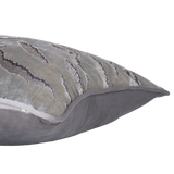 Side shot of a decorative cushion in a shiny silver velvet with a tiger stripe pattern