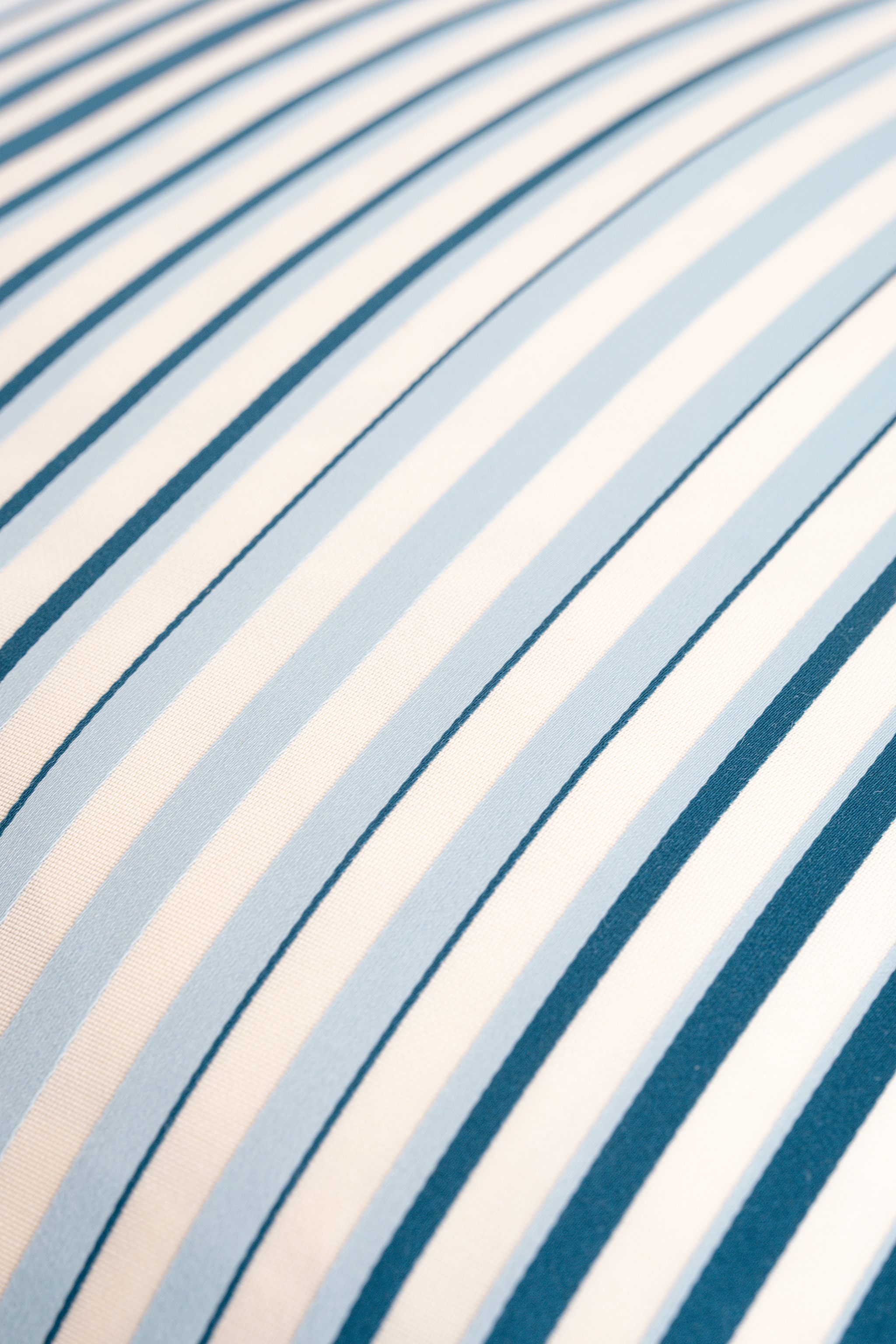 Close-up of blue and white striped fabric texture