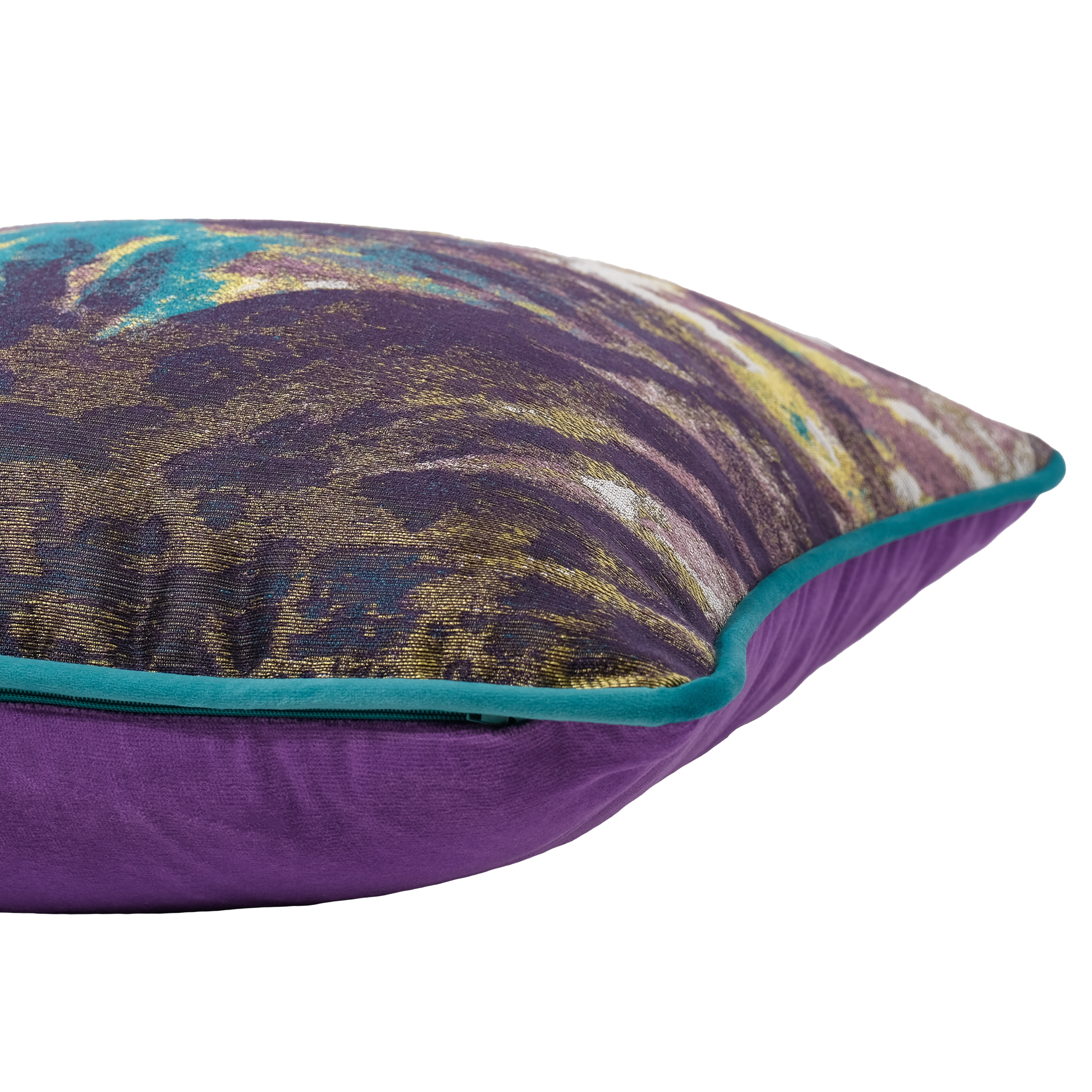 A close-up of a decorative throw pillow featuring a purple velvet-like base, a multicolor abstract patterned top, and a teal piped edge on a white background.