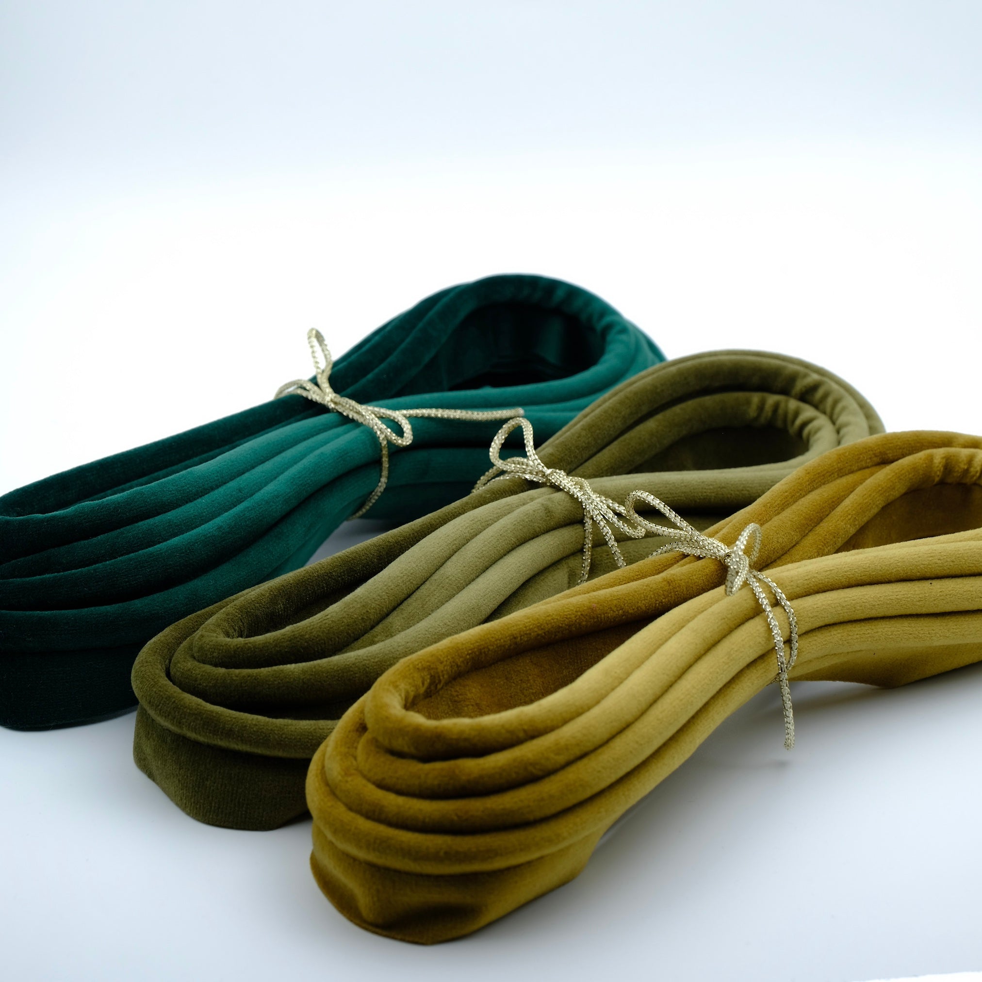 photo of three bundles of velvet piping cord in shades of green