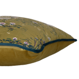 Side shot of a cushion with white swans and flowers on an olive coloured base