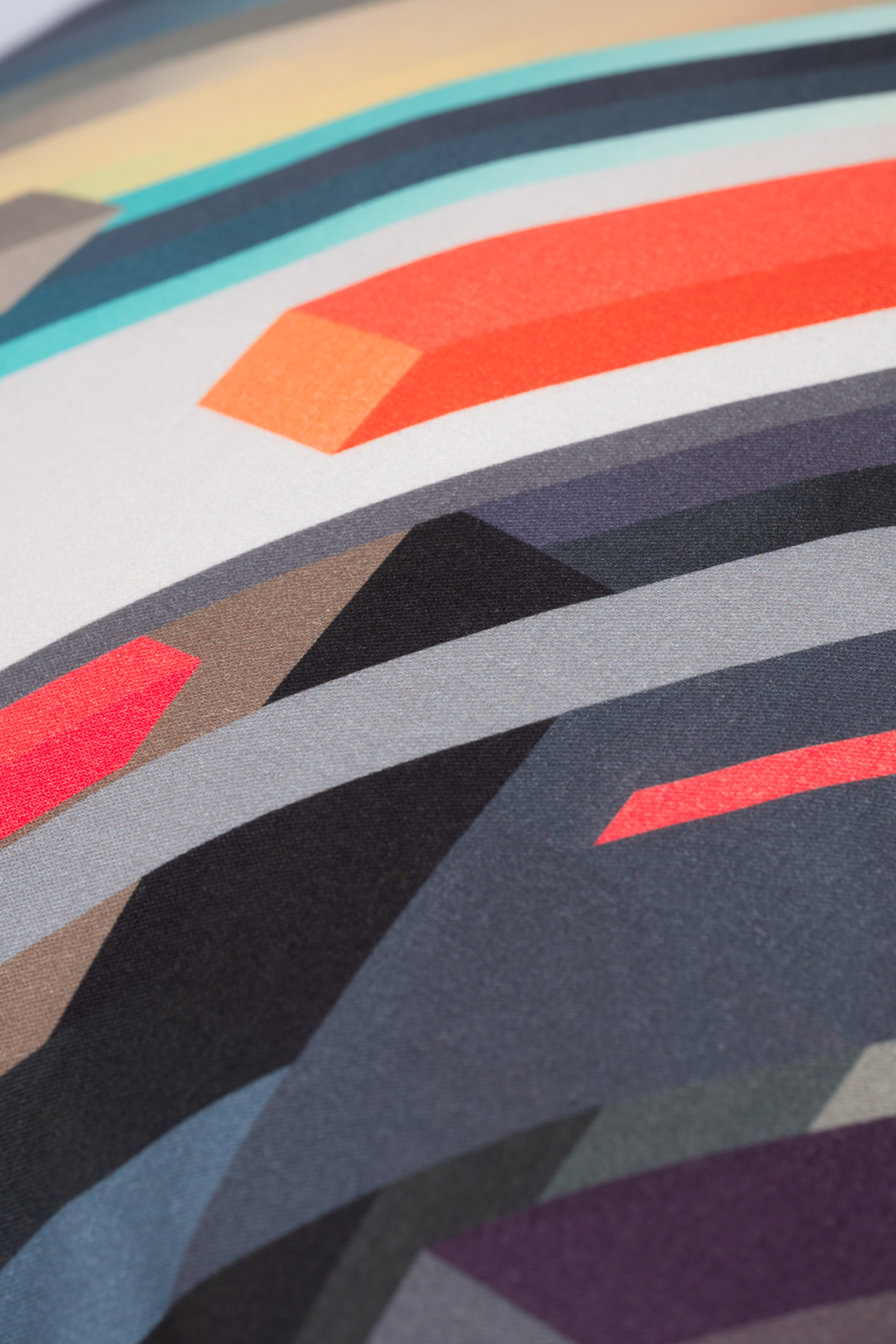 Close-up of a colorful abstract pattern with geometric shapes.
