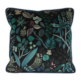 Decorative cushion with a leafy botanical pattern on a black velvet background