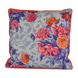 Floral patterned cushion with pink, coral and orange dahlias on a light blue background