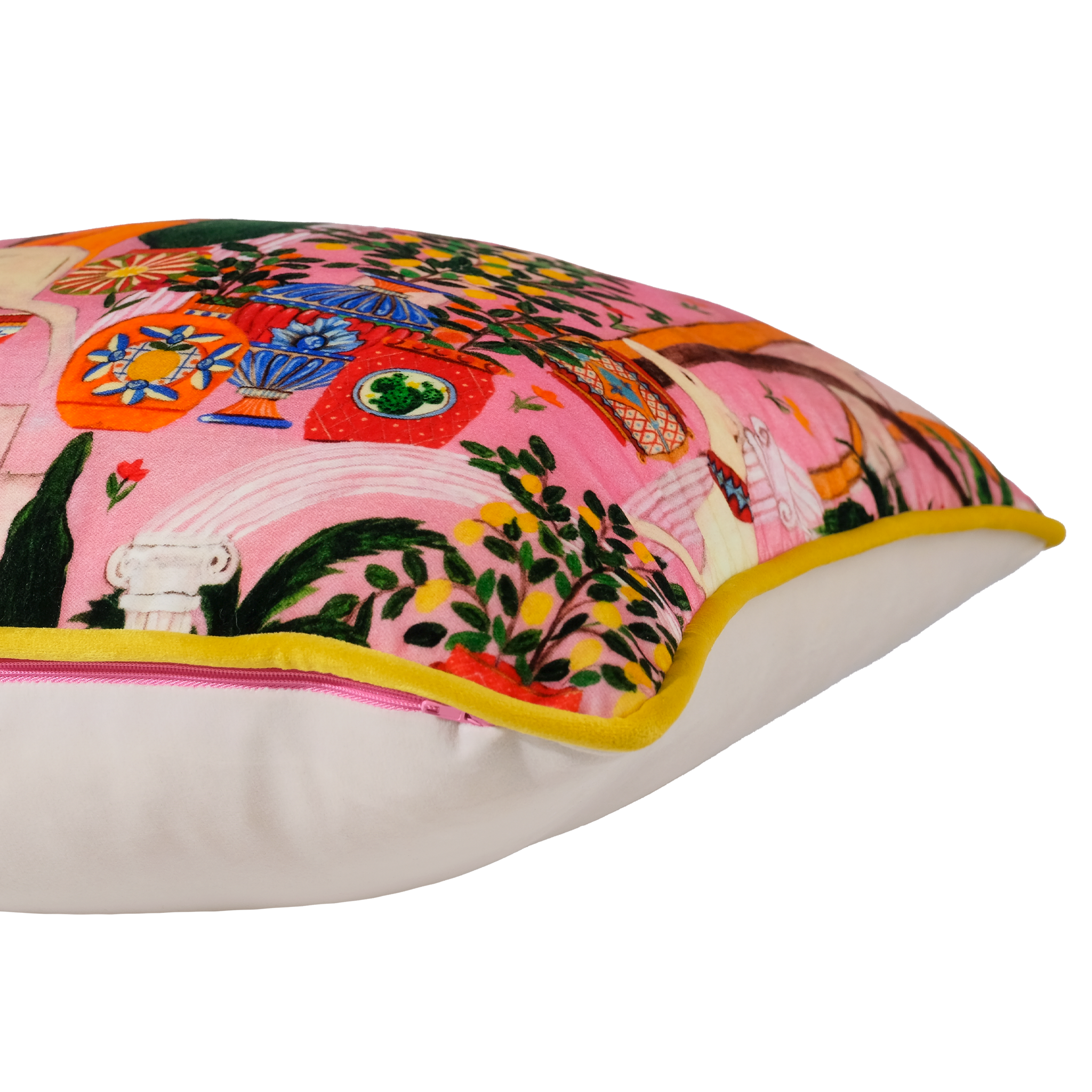 A square decorative throw pillow with a vibrant pink background and a colorful embroidered scene featuring classical figures, vases, and foliage. The pillow has a white underside and a bright yellow piping trim along the edge.
