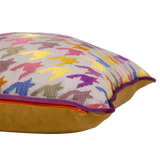 Multicoloured cushion with an embroidered houndstooth pattern in purple gold and orange on a natural linen base