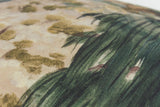 Close-up of a fabric with green foliage in a painterly style