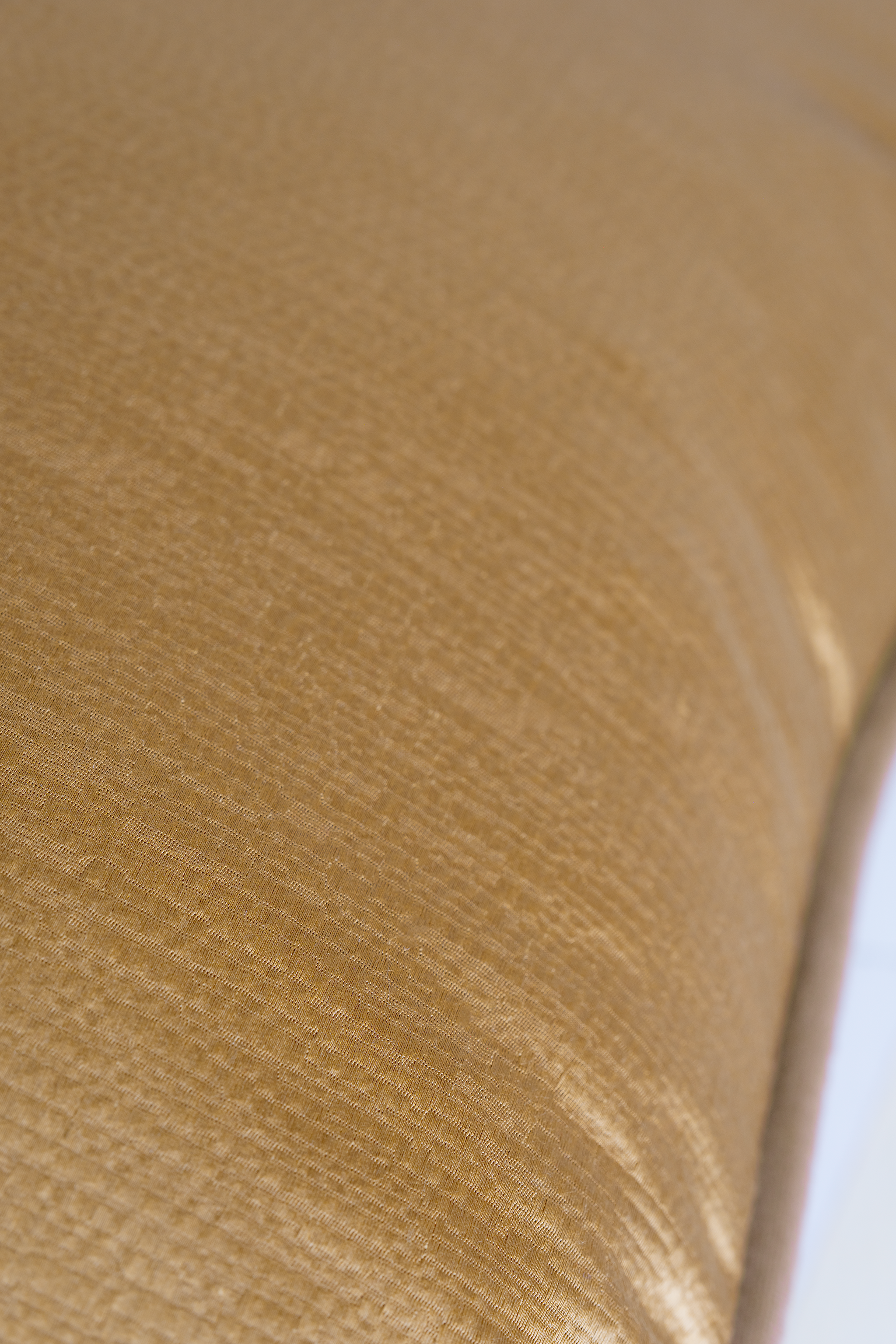 Close-up of a textured gold fabric