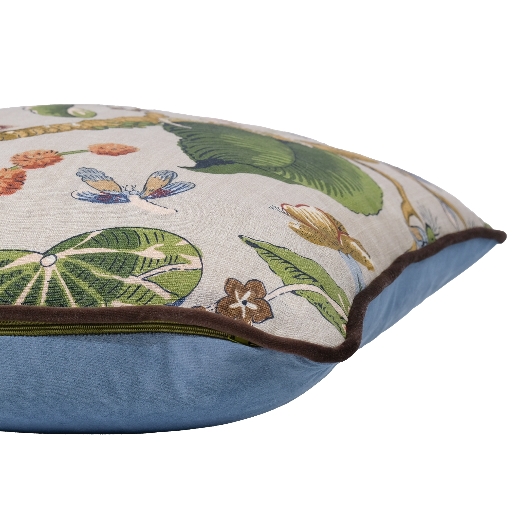 A square decorative throw pillow with a botanical and butterfly print on a light beige linen-like fabric, featuring a blue velvet-like bottom section and a dark brown piping edge, shown on a white background.