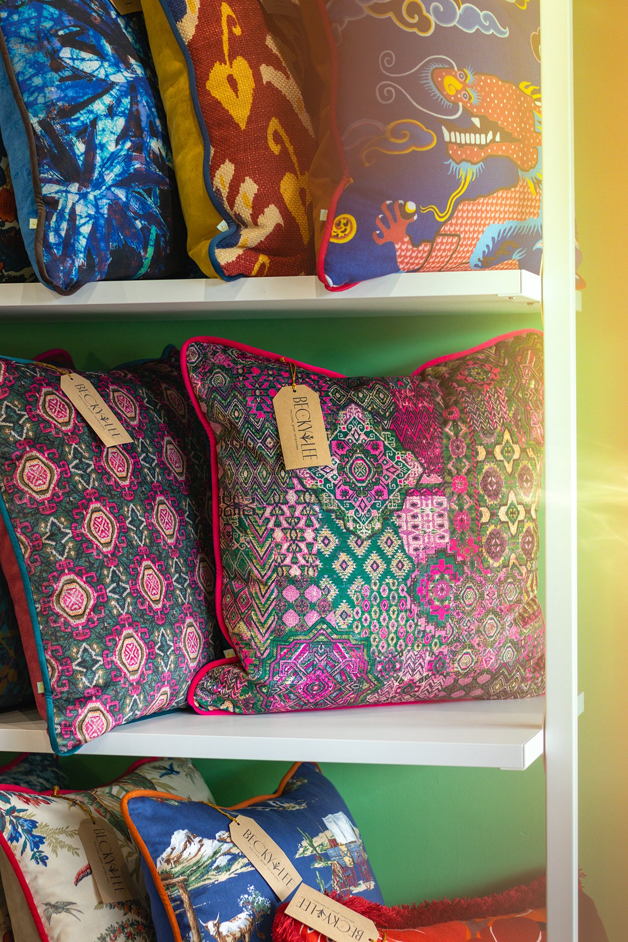 Colorful persian patterned cushions on a shelf in a boutique