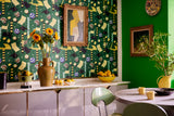 Kitchen with MOTO BELLO Green wallpaper, complemented by vibrant decor, lush greenery decorative sunflowers and lemons in a bowl