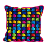 Neon bright cushion with rainbow of coloured beans on a black background