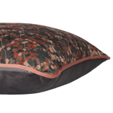 Velvet cushion with delicate leafy vines in mole and clay colours.