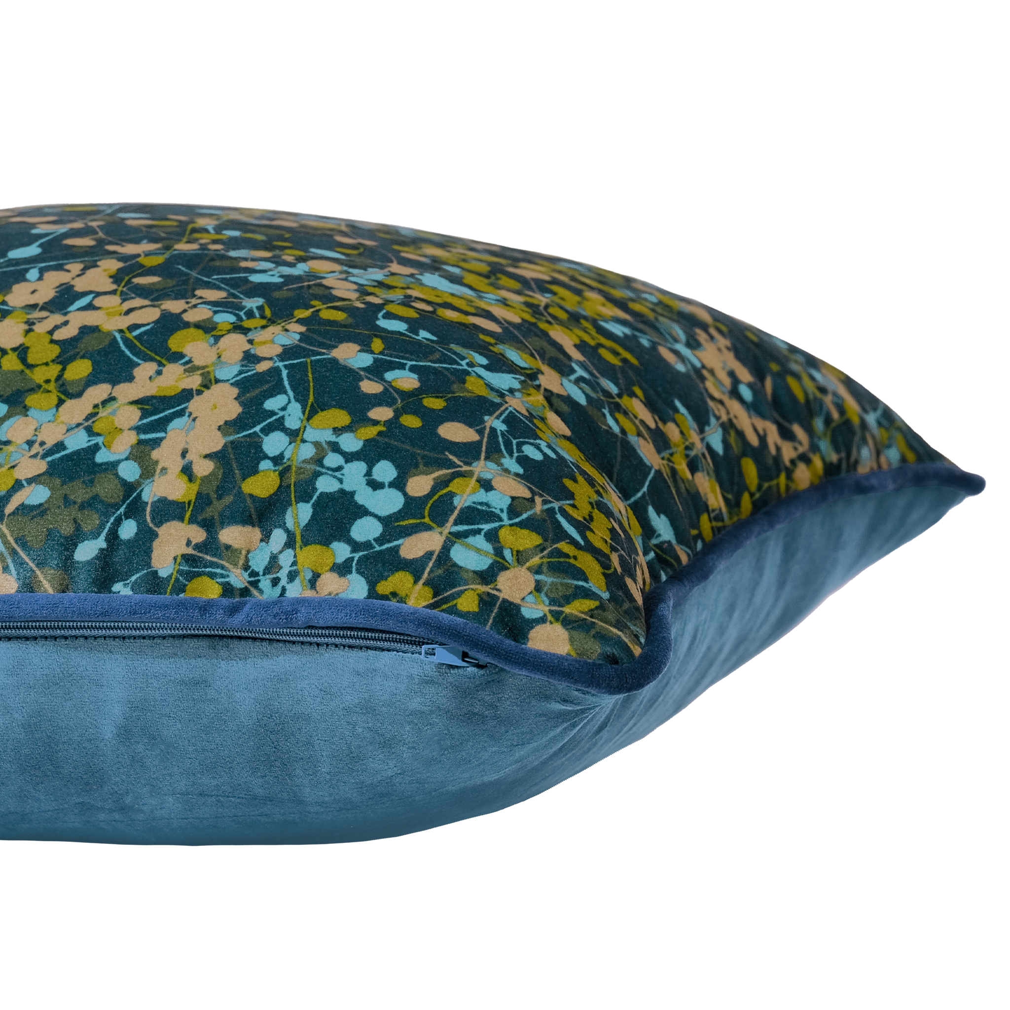 Side shot of a cushion with a fine vine pattern in green and aqua on a navy background