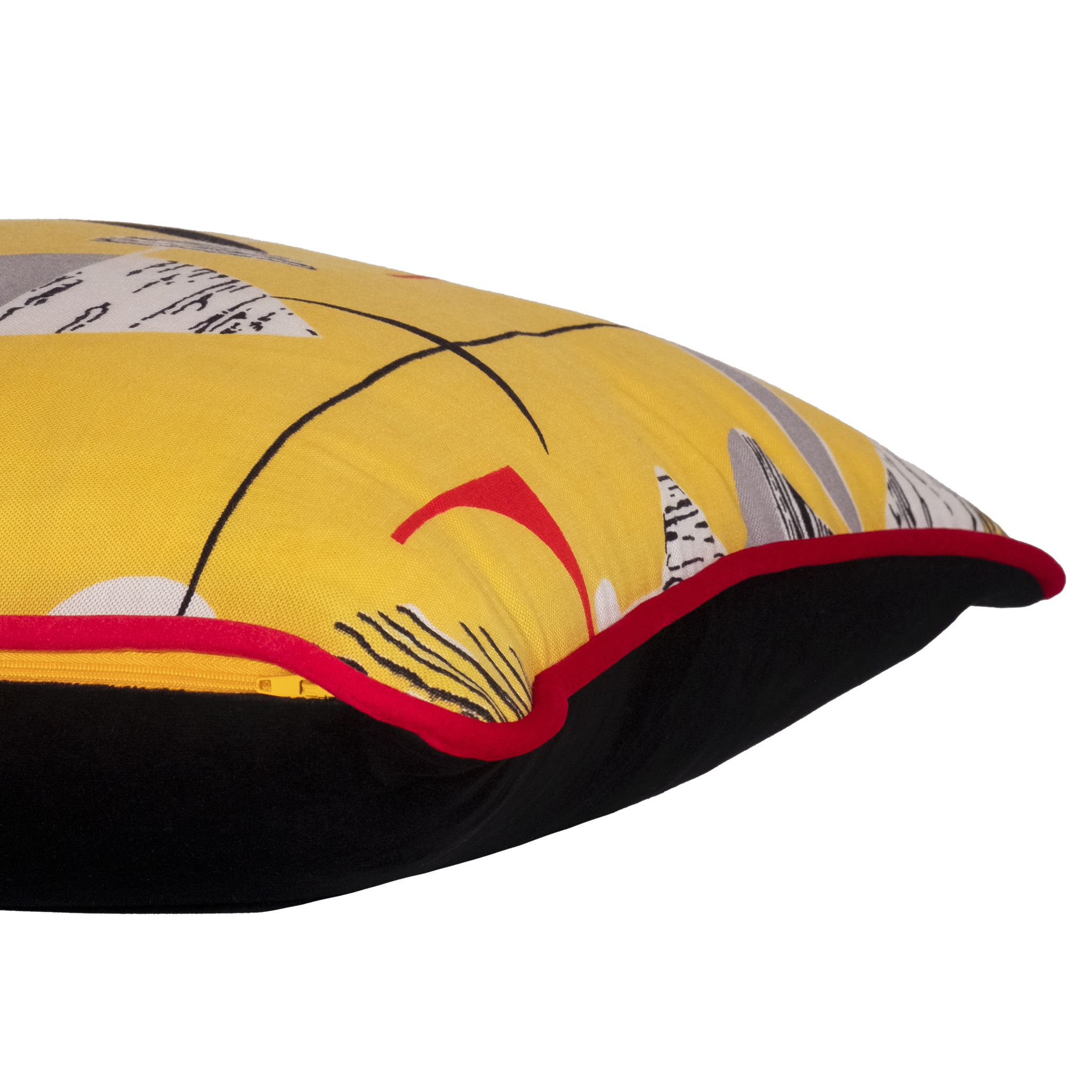 Side view of a colourful cushion made from a vintage fabric with geometric shapes on a bright yellow base.