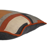 Side shot of a geometric linen cushion in black, rust, and tan linen