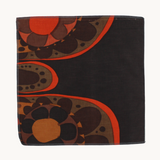 Photo of a cushion front; vintage fabric from the 1970s - a large scale design in a classic 70s palette of orange and brown