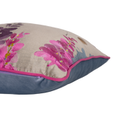 Decorative pillow with pink floral design on a beige background