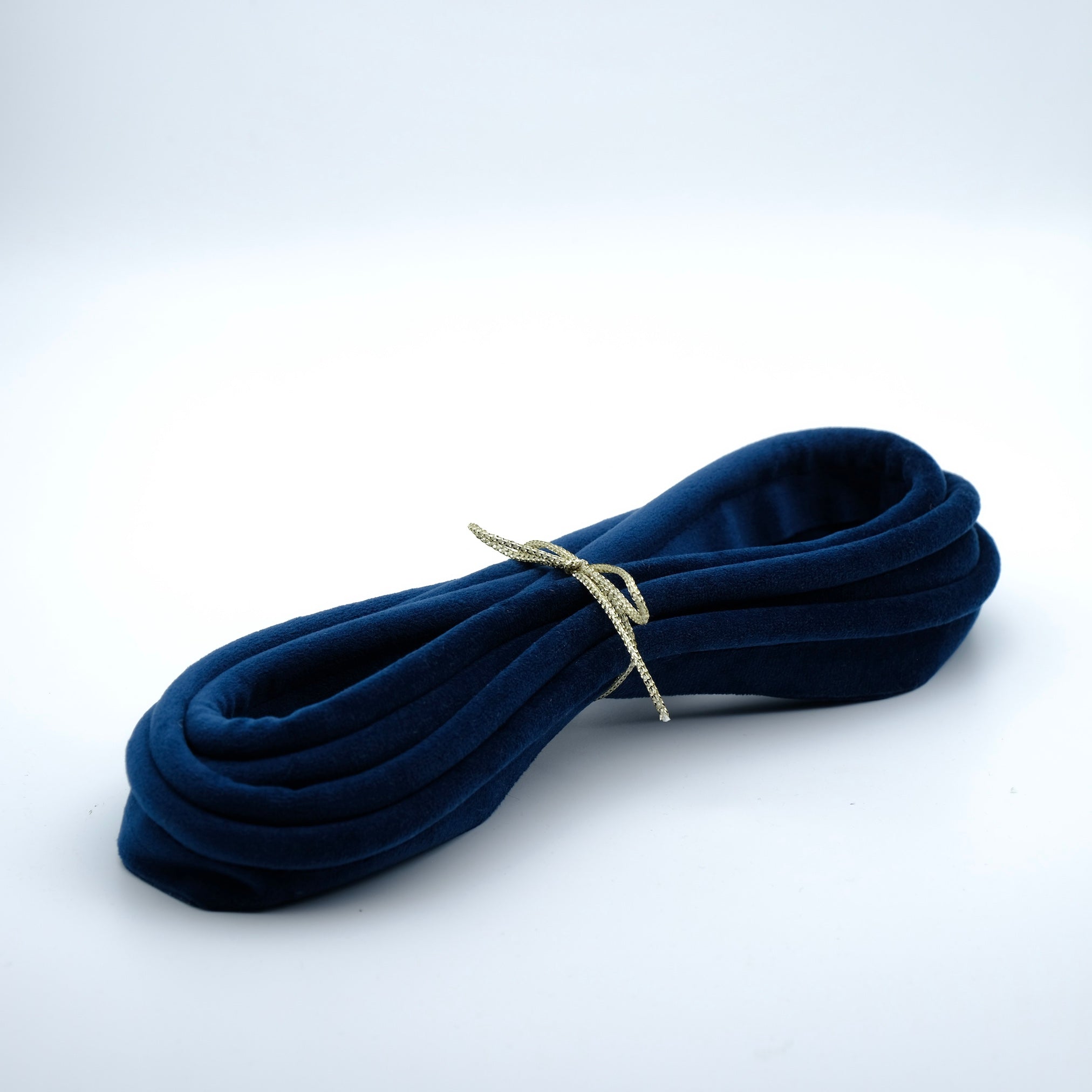 photo of a bundle of navy coloured velvet piping