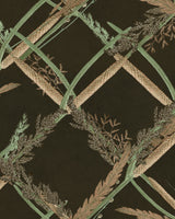 Ornamental Reed Anthracite wallpaper: interwoven green stems, wheat, and fern leaves on a dark brown background with a textured look