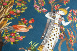 Linen with intricate design of a person, bird, and floral elements on a blue background