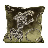 Decorative pillow with leopard design on a green background