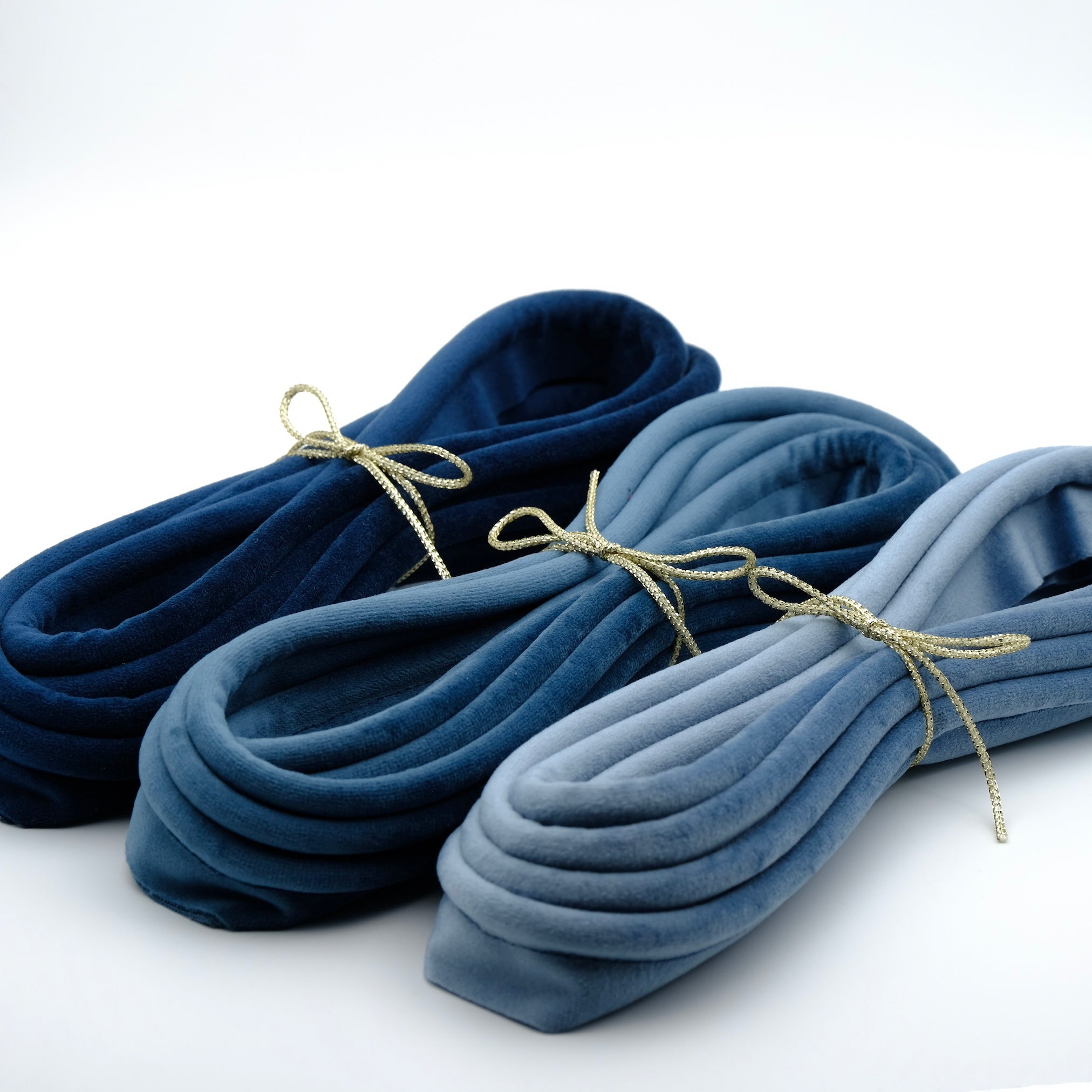 photo of three bundles of velvet piping cords in blue tones