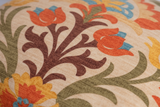 Close up of a printed fabric with a decorative design.