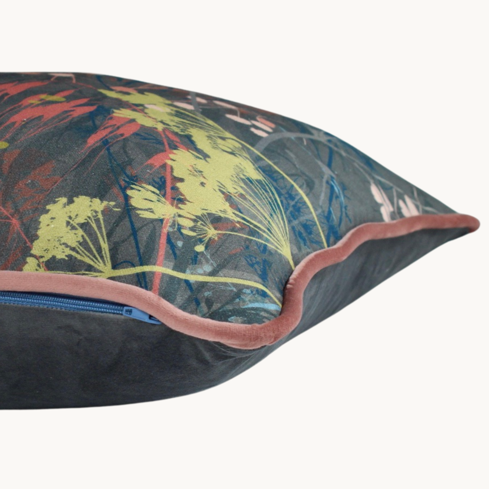 Sides hot of a dusty coloured botanical cushion