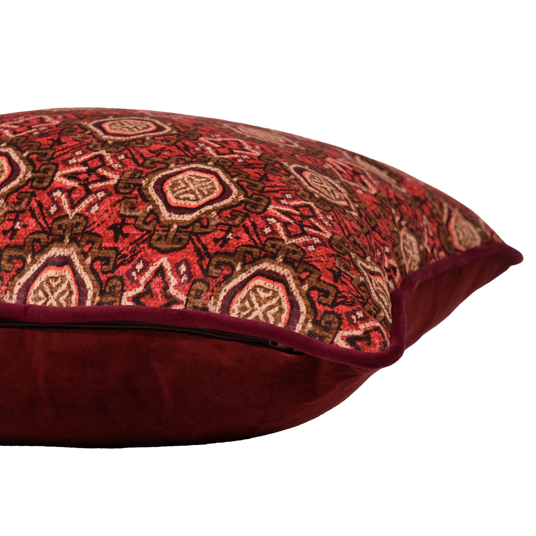 Side shot of a decorative pillow with a red and brown Persian geometric pattern