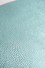 Close up of a textured topaz coloured fabric