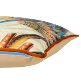 Decorative cushion with a colorful fearther design on a neutral background