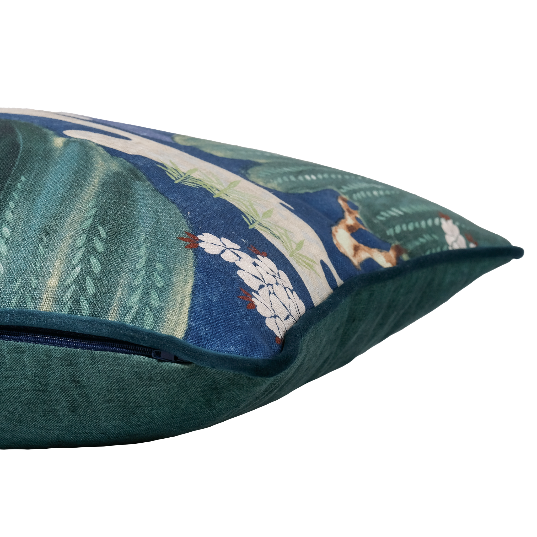 A close-up of a decorative throw pillow showing its textured teal linen and a printed oriental pattern
