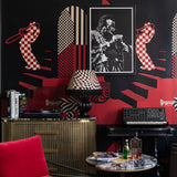 Abstract wallpaper with red and black silhouettes of musicians, checkerboard and striped patterns.