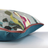 Side view of a cushion in a floral with a light grey background and large scale blooms in pink, magenta and very pale green