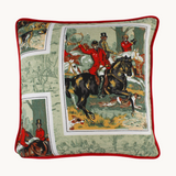 Photo of a vintage barkcloth cushion with a classic english hunting scene of a huntsman on his horse with hounds at his feet.