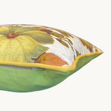 Cushion made from a large scale vintage floral in yellow, khaki, olive and cinnamon