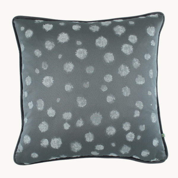 Photo of a cushion with a large scale pewter mottled spot design