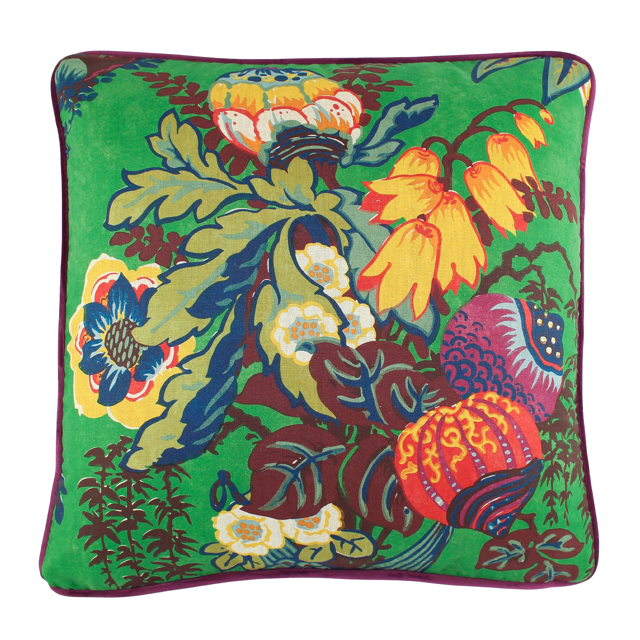 Colorful floral pillow with vibrant patterns on a green background