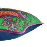 colourful floral cushion with an emerald green background