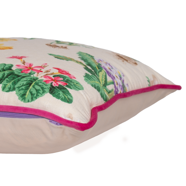 Floral cushion with a cream background and old English flowers