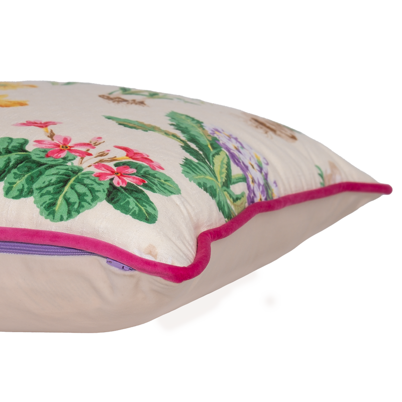 Floral cushion with a cream background and old English flowers