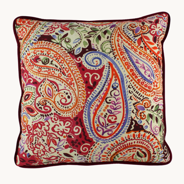 Photo of a cushion with a colourful paisley design in autumn colours