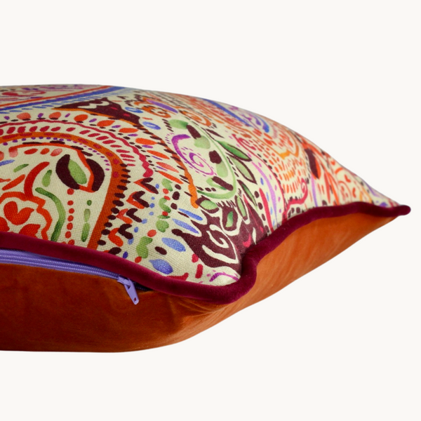 Side shot of a cushion with a colourful paisley design