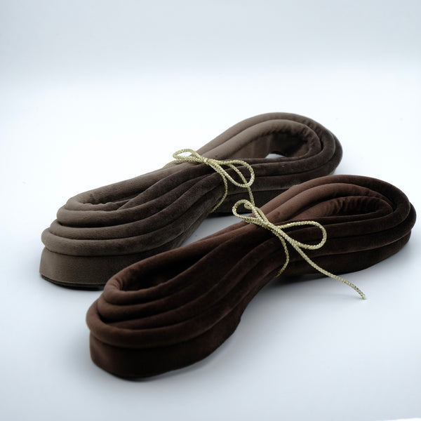 Photo of two bundles of velvet piping in bark and gunmetal colours