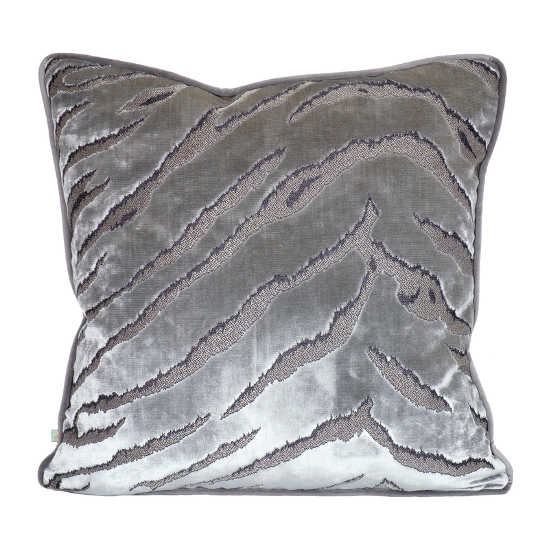 Decorative cushion in a shiny silver velvet with a tiger stripe pattern