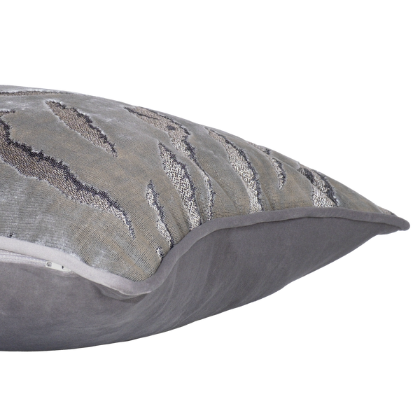 Side shot of a decorative cushion in a shiny silver velvet with a tiger stripe pattern