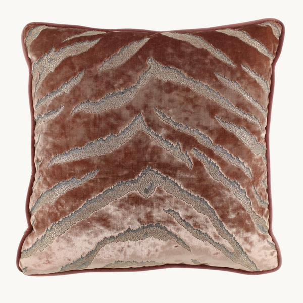 Photo of a pink velvet cushion with lustrous animal print pattern